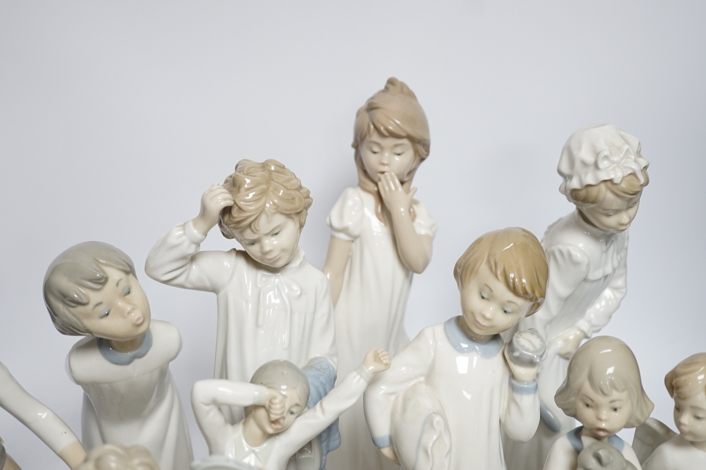 A group of various Lladro figures (16 + plaque)